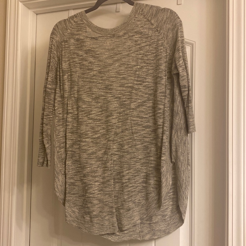 Express light sweater with criss cross design on back.